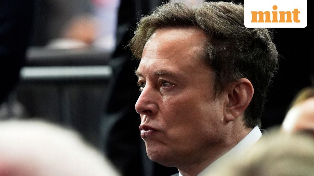 FILE - Elon Musk attends a memorial for conservative activist Charlie Kirk, Sunday, Sept. 21, 2025, at State Farm Stadium in Glendale, Ariz. (AP Photo/Julia Demaree Nikhinson, File)