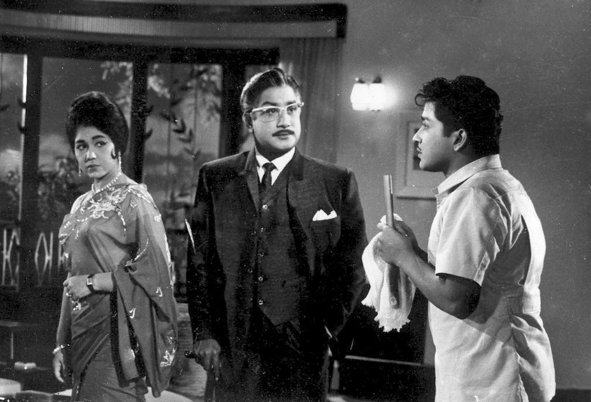 Sivaji Ganesan, Sowcar Janaki and Sivakumar in the Tamil film 'Uyarndha Manithan'